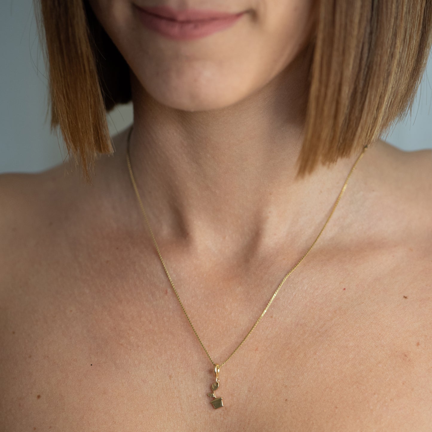 Charm Rinasci Placcato Oro